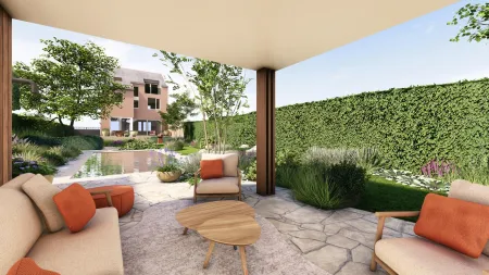 Overdekt terras met loungebank en poef in de moderne tuin te Aarschot