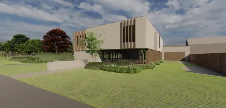 Voorgevel bedrijfsgebouw met organische plantvakken en siergrassen in Sint-Katelijne-Waver
